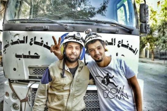 A Syrian Civil Defense member poses for a photo.